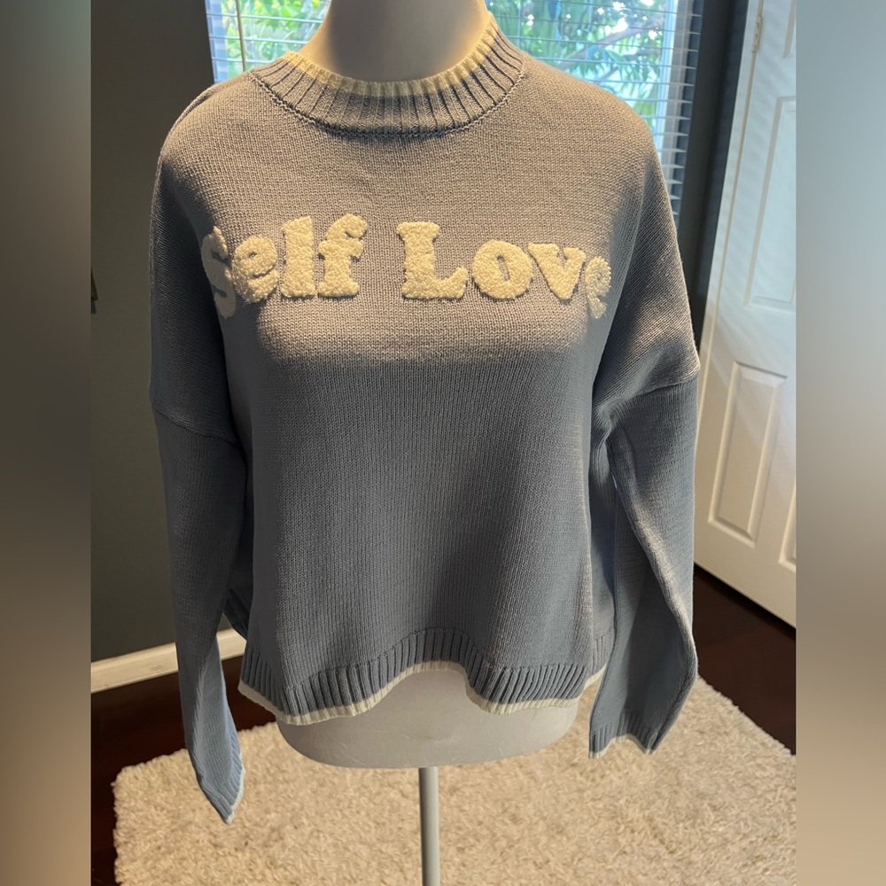 New Self Love powder blue cardigan. Rounded collar with white trim. Size…